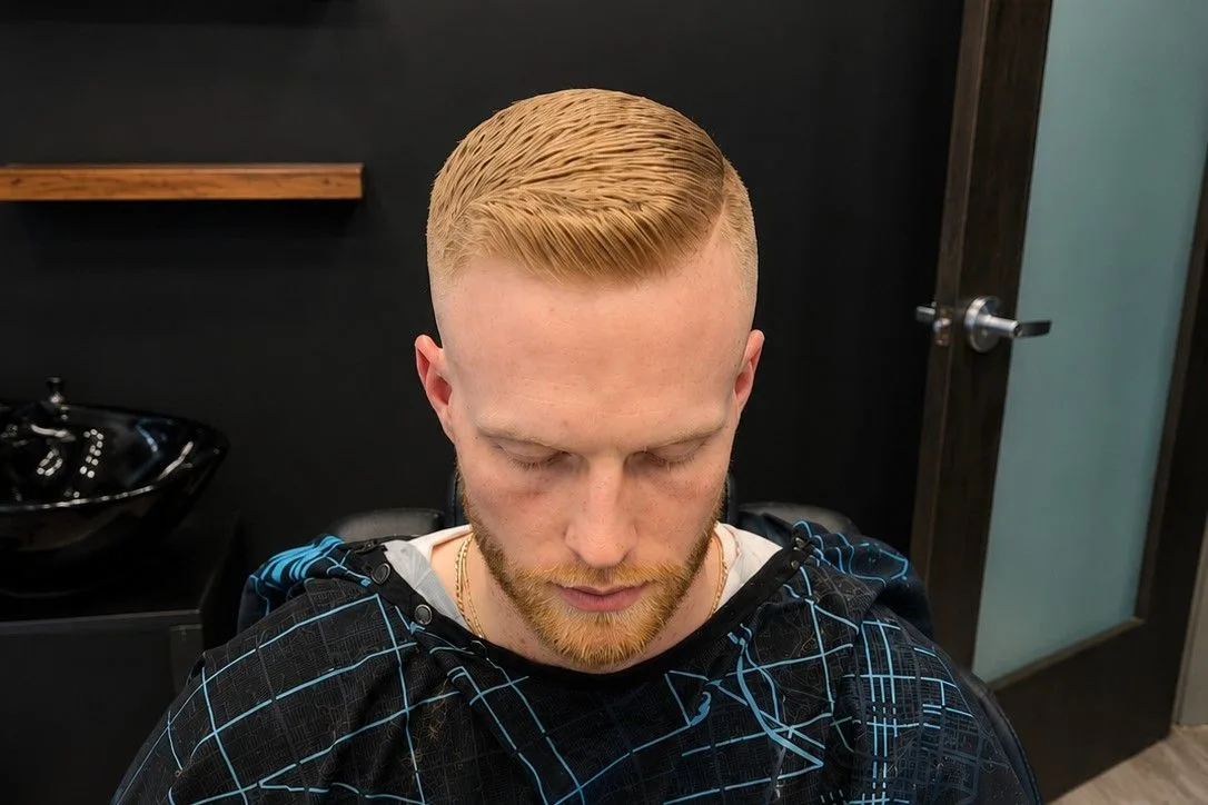 Clean scissor-and-fade cut on fine straight hair