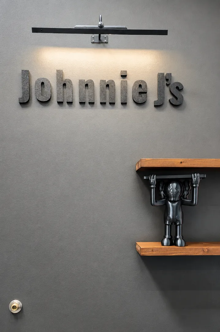 Johnnie J's sign on the studio wall