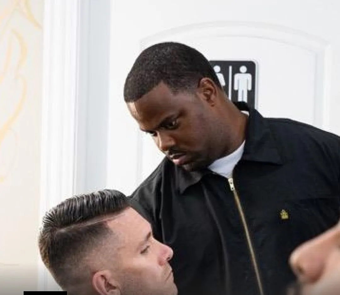 Johnnie J working on a client's fade in the studio